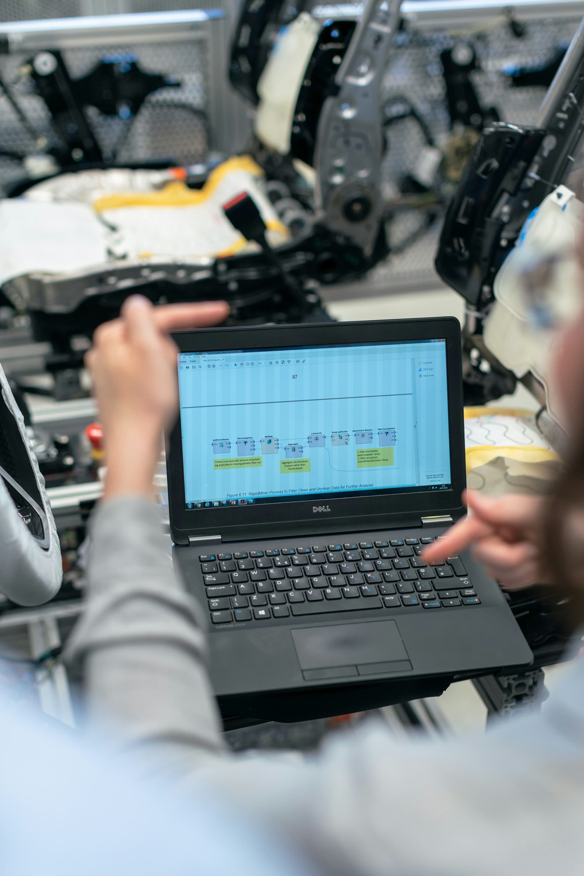 Engineering team reviewing technical plans